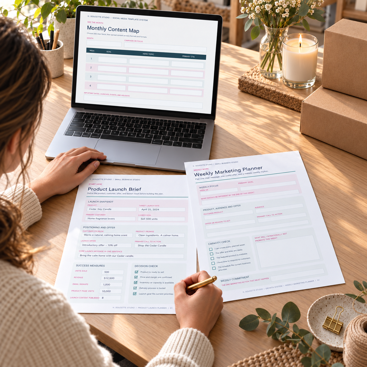 Small-business owner planning a product launch with the Brand and Marketing Bundle at a clean desk.