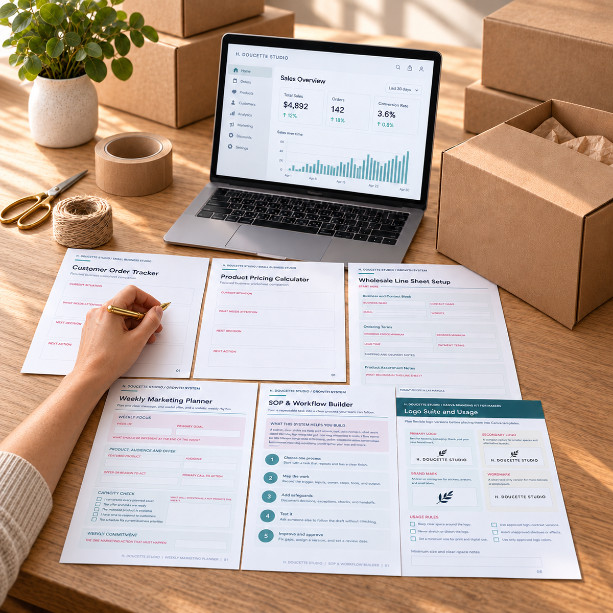 Maker writing in the Customer Order Tracker beside Maker Business Library worksheets, a sales dashboard, and an open shipping box.