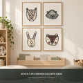 Photorealistic playroom reading corner with a four-print woodland animal gallery grid.