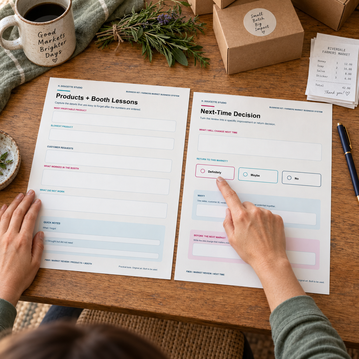 Maker reviewing product lessons and the next-market decision with two natural hands