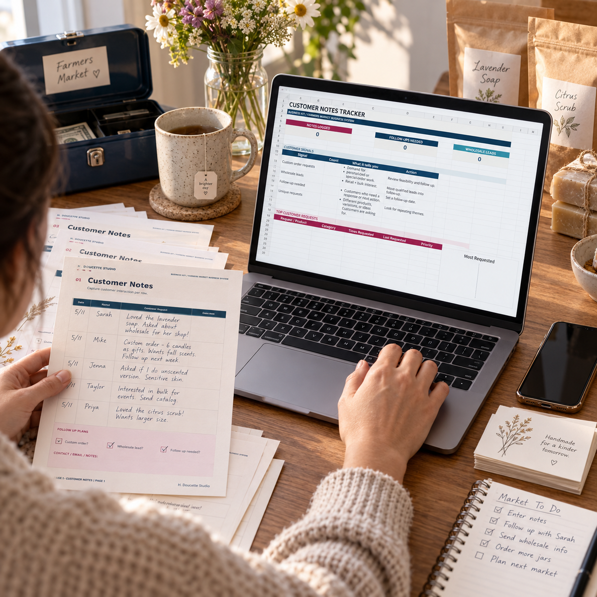 Maker transferring handwritten customer notes into the digital tracker after market