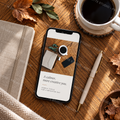 Warm neutral workspace stock photo displayed as a branded social media post on a smartphone